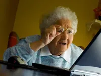 Old lady at computer finds the Internet