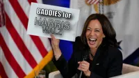 Kamala Harris holding sign