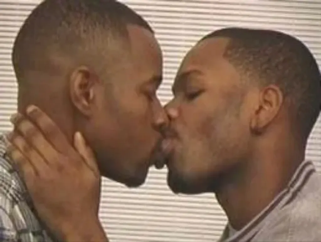 2 gay black mens kissing