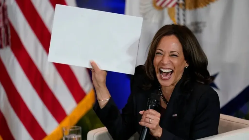 Kamala Harris holding sign