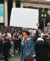 Man holding sign