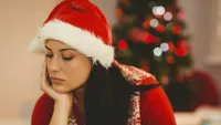 SAD CHRISTMAS GIRL SANTA HAT